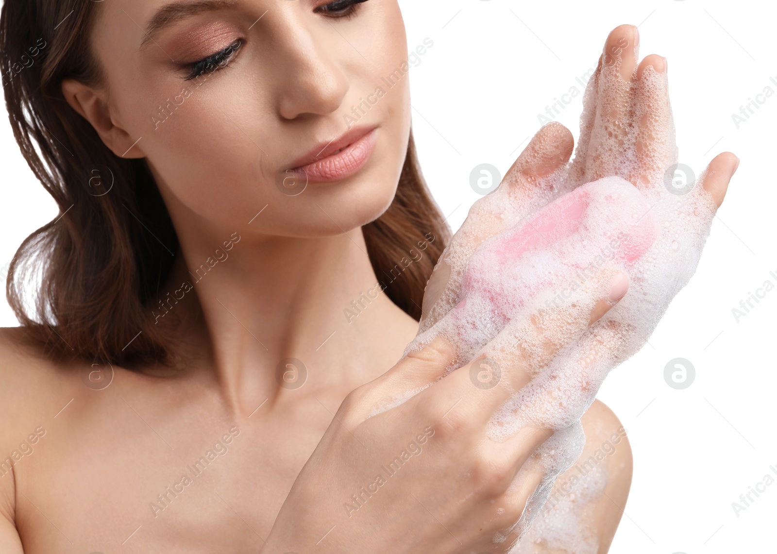 Beautiful woman washing hands with soap bar on white background, closeup Photo of Beautiful woman washing hands with soap bar on white background, closeup