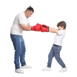 Photo of Father and his son boxing on white background