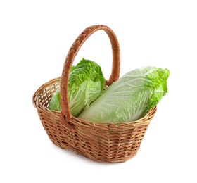 Photo of Fresh Chinese cabbages in wicker basket isolated on white