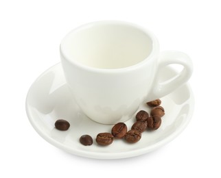 Photo of Ceramic cup with roasted coffee beans isolated on white