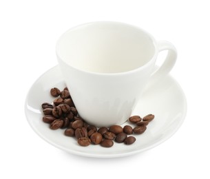 Photo of Ceramic cup with roasted coffee beans isolated on white
