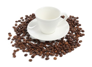 Photo of Ceramic cup with roasted coffee beans isolated on white