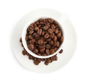 Photo of Ceramic cup with roasted coffee beans isolated on white, top view