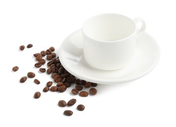 Photo of Ceramic cup with roasted coffee beans isolated on white