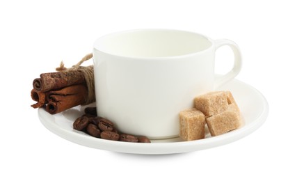Photo of Ceramic cup with roasted coffee beans, sugar and cinnamon isolated on white