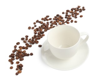 Photo of Ceramic cup with roasted coffee beans isolated on white
