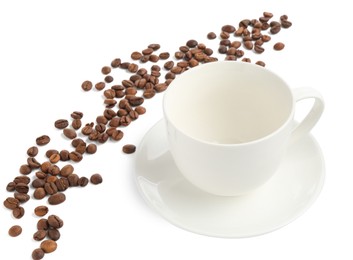 Photo of Ceramic cup with roasted coffee beans isolated on white