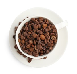 Photo of Ceramic cup with roasted coffee beans isolated on white, top view