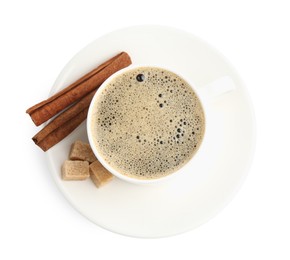 Photo of Aromatic coffee in cup, cinnamon and sugar cubes isolated on white, top view