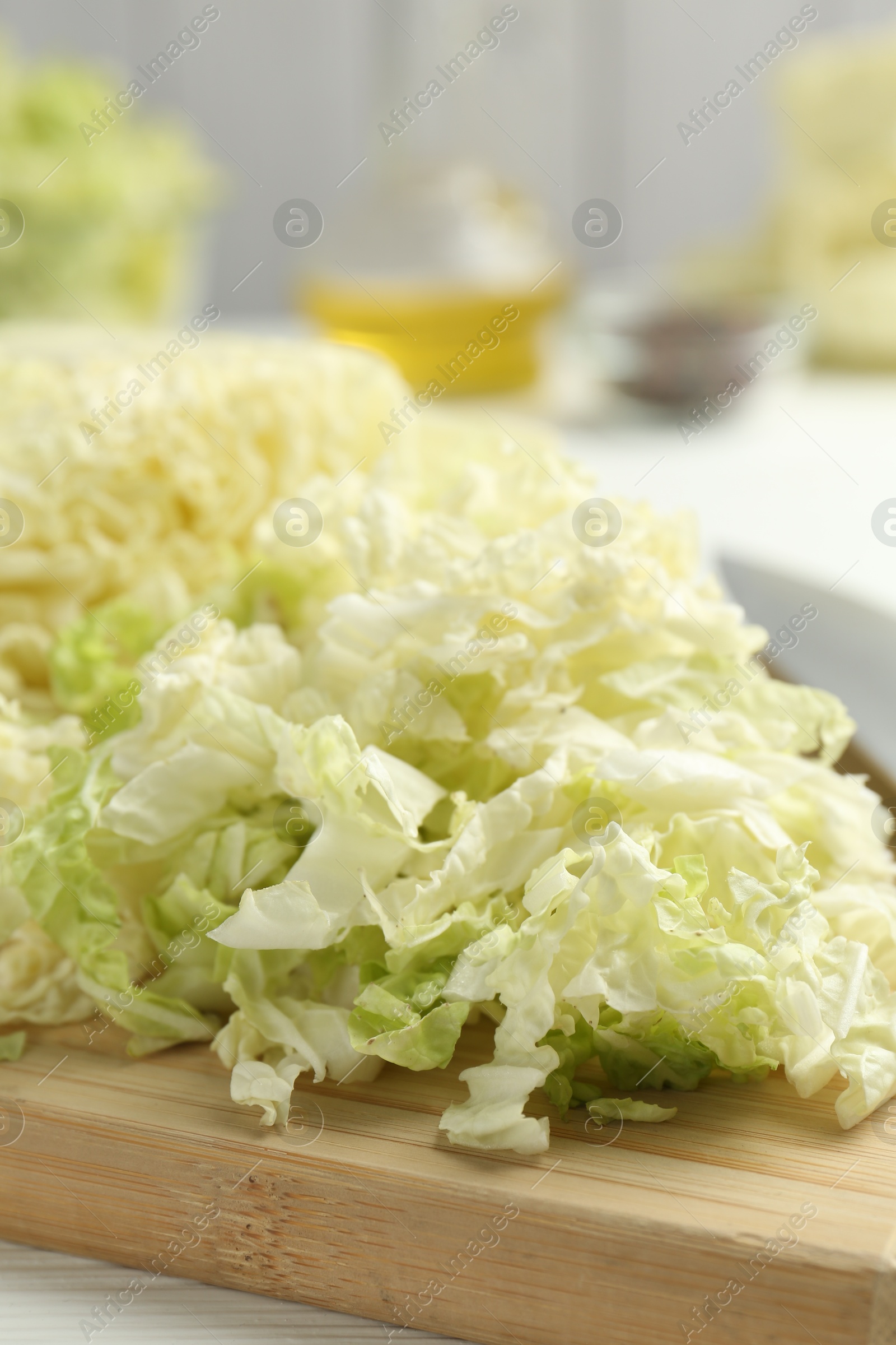 Cut Chinese cabbage on white table, closeup Photo of Cut Chinese cabbage on white table, closeup