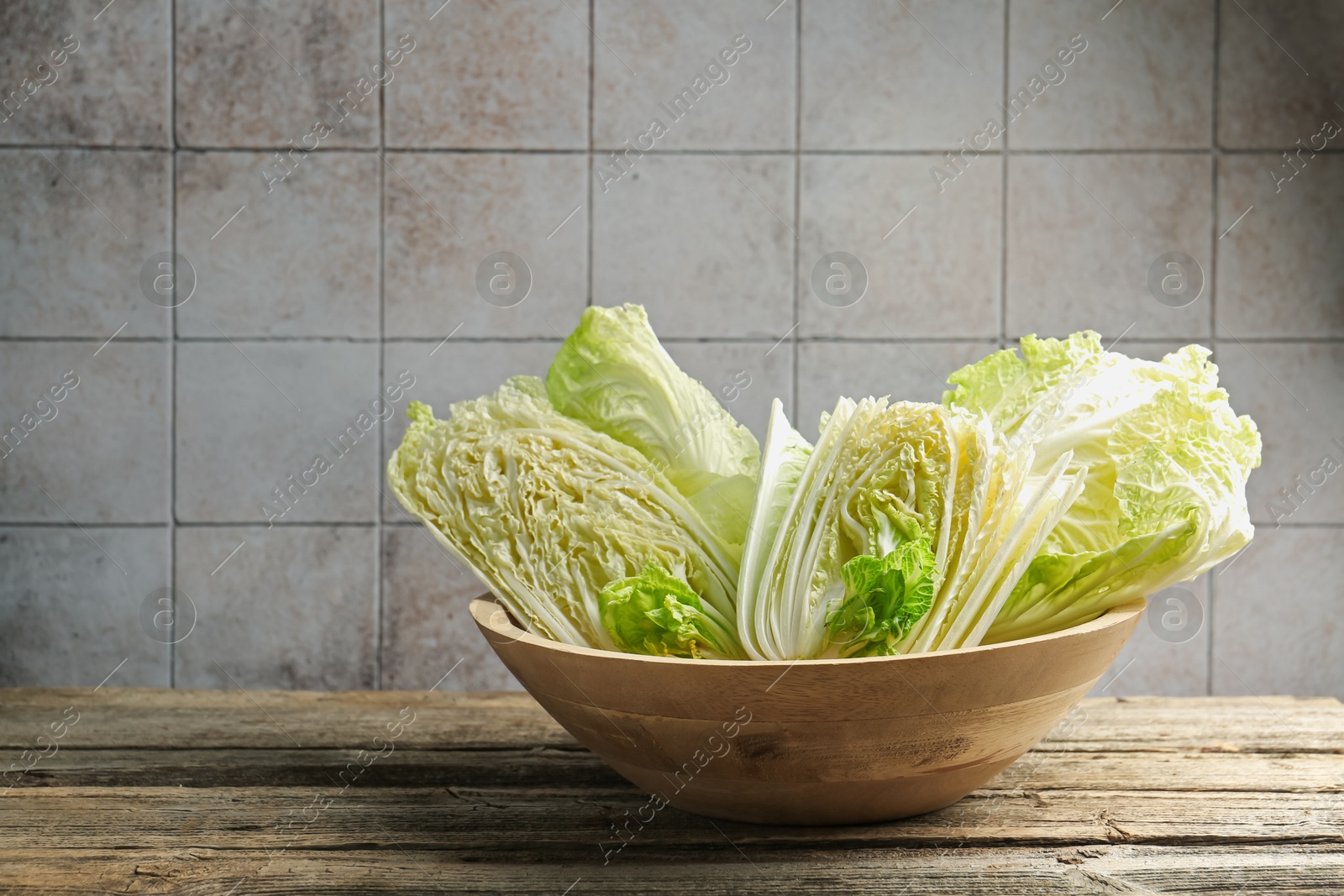 Fresh Chinese cabbages on wooden table, closeup. Space for text Photo of Fresh Chinese cabbages on wooden table, closeup. Space for text