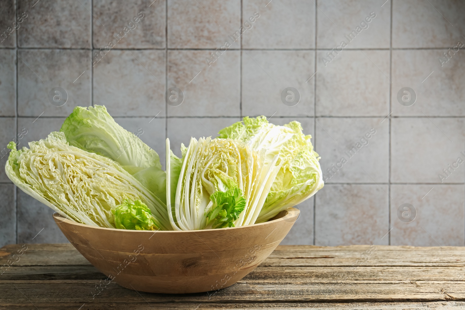 Fresh Chinese cabbages on wooden table, closeup. Space for text Photo of Fresh Chinese cabbages on wooden table, closeup. Space for text
