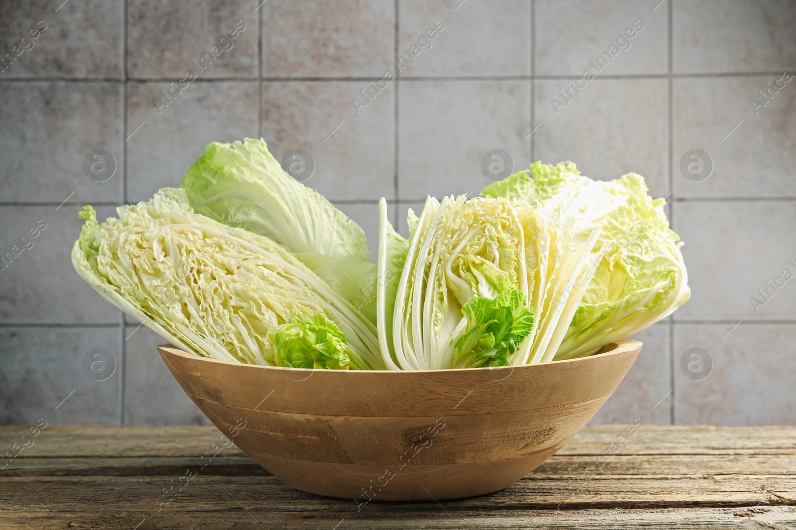 Fresh Chinese cabbages on wooden table, closeup Photo of Fresh Chinese cabbages on wooden table, closeup