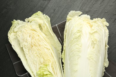 Photo of Chinese cabbages on black table, top view