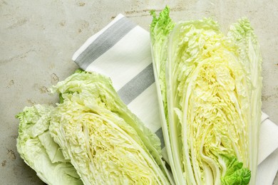 Photo of Cut Chinese cabbage on light grey table, top view