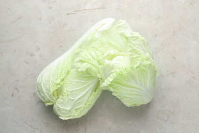 Photo of Fresh Chinese cabbages on light grey table, top view