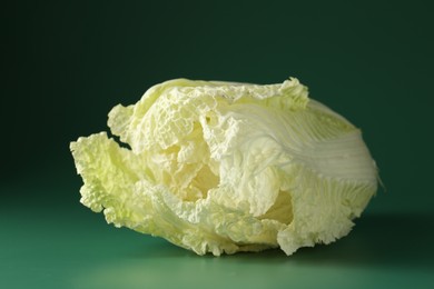 Photo of Fresh Chinese cabbage on green background, closeup