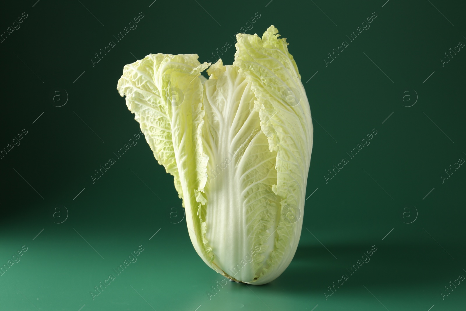 Fresh Chinese cabbage on green background, closeup Photo of Fresh Chinese cabbage on green background, closeup