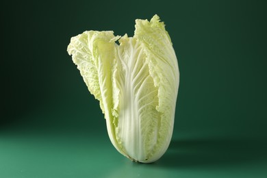 Photo of Fresh Chinese cabbage on green background, closeup
