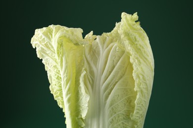 Photo of Fresh Chinese cabbage on green background, closeup