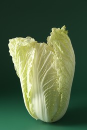 Photo of Fresh Chinese cabbage on green background, closeup