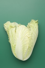 Photo of Fresh Chinese cabbage on green background, top view