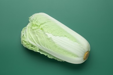 Photo of Fresh Chinese cabbage on green background, top view