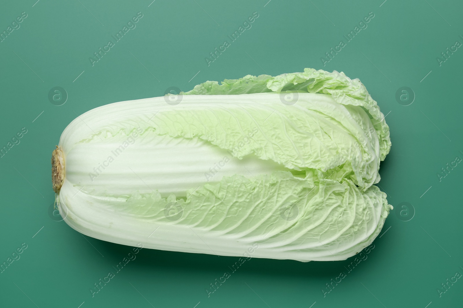 Fresh Chinese cabbage on green background, top view Photo of Fresh Chinese cabbage on green background, top view