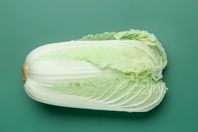 Photo of Fresh Chinese cabbage on green background, top view