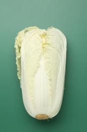 Photo of Fresh Chinese cabbage on green background, top view