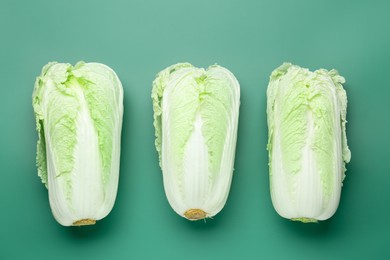 Photo of Fresh Chinese cabbages on green background, flat lay