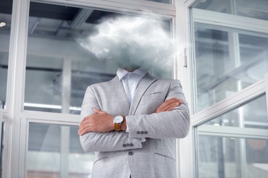 Image of Businessman with cloud instead of head in office. Mental health