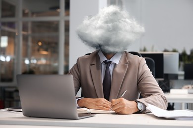 Image of Businessman with cloud instead of head at table in office. Mental health
