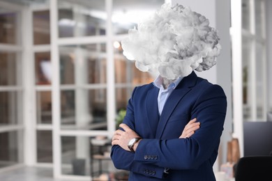 Image of Businessman with cloud instead of head in office. Mental health