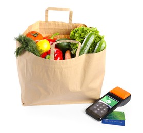 Image of Payment terminal with NFC system, credit card and food products in paper bag on white background