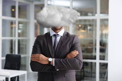 Image of Businessman with cloud instead of head in office. Mental health