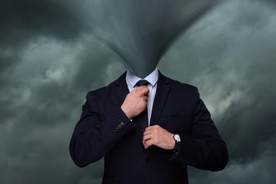 Image of Businessman with tornado instead of head against cloudy sky. Mental health