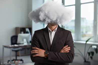Image of Businessman with cloud instead of head in office. Mental health