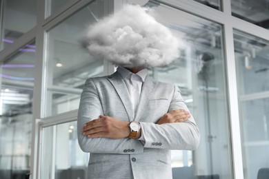 Image of Businessman with cloud instead of head in office. Mental health