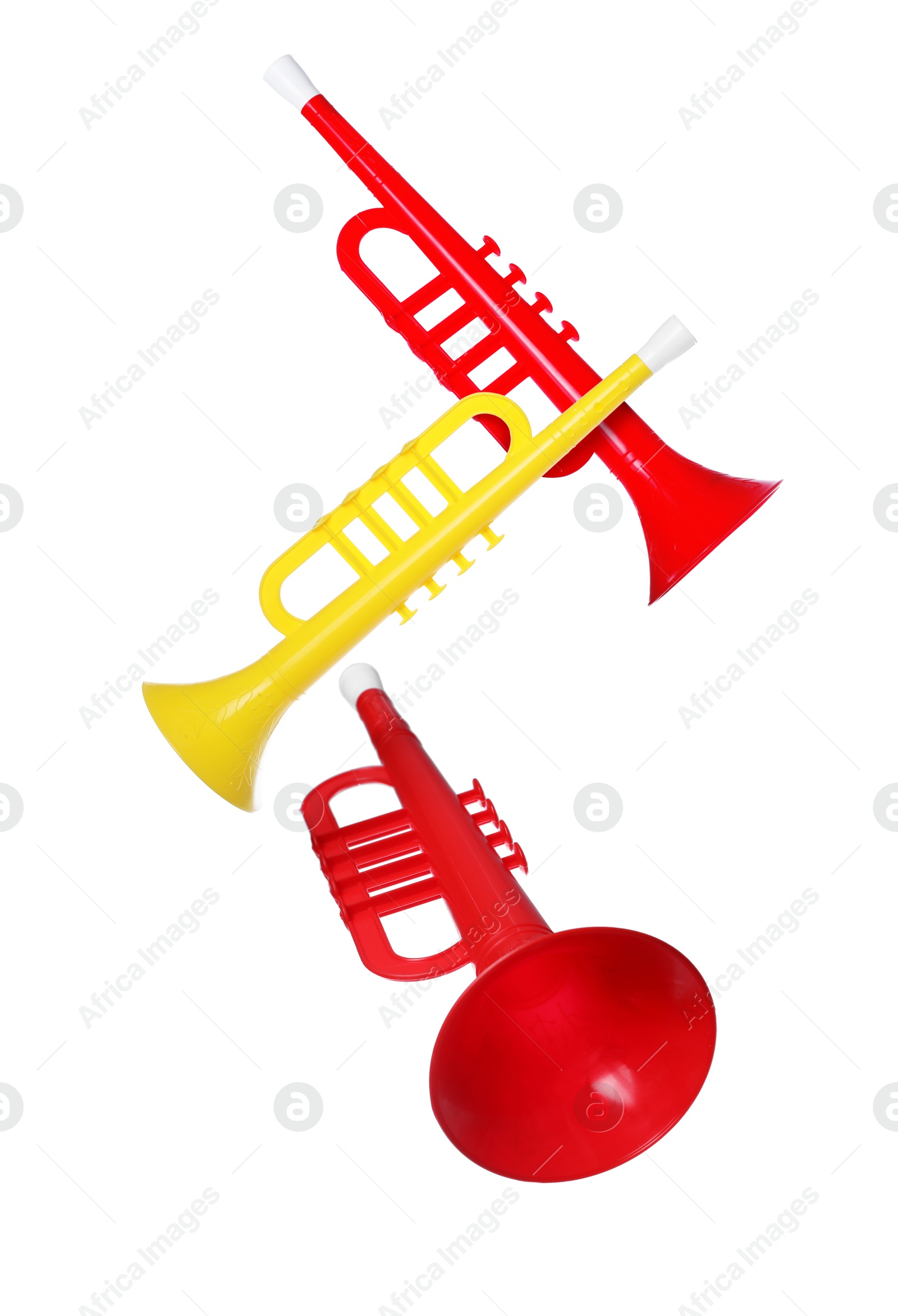 Toy horns in air on white background. Child's musical instrument Image of Toy horns in air on white background. Child's musical instrument