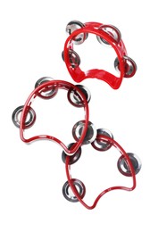 Image of Toy tambourines in air on white background. Child's musical instrument