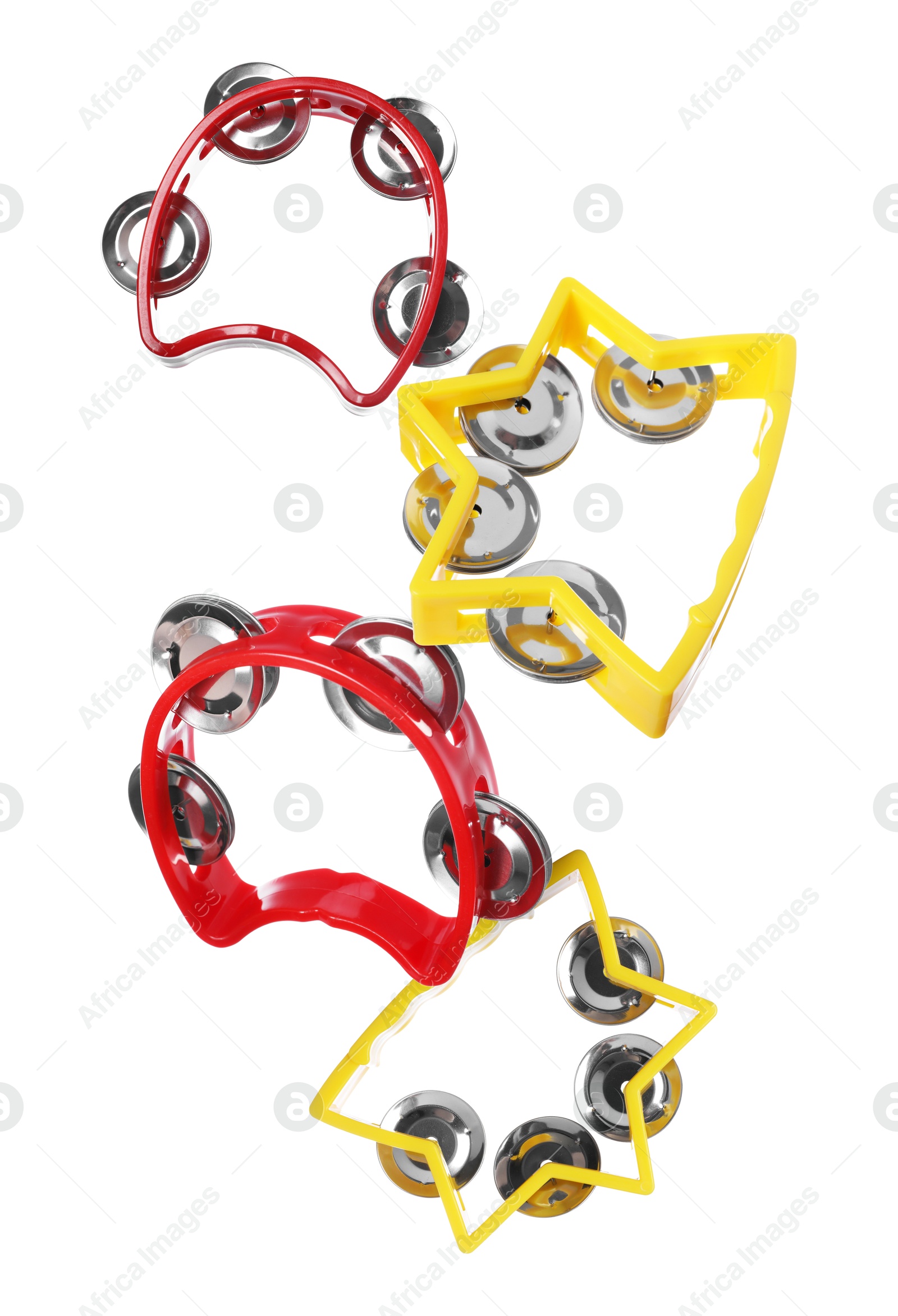 Toy tambourines in air on white background. Child's musical instrument Image of Toy tambourines in air on white background. Child's musical instrument