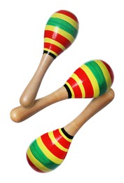 Image of Toy maracas in air on white background. Child's musical instrument