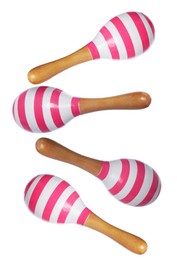 Image of Toy maracas in air on white background. Child's musical instrument