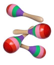 Image of Toy maracas in air on white background. Child's musical instrument