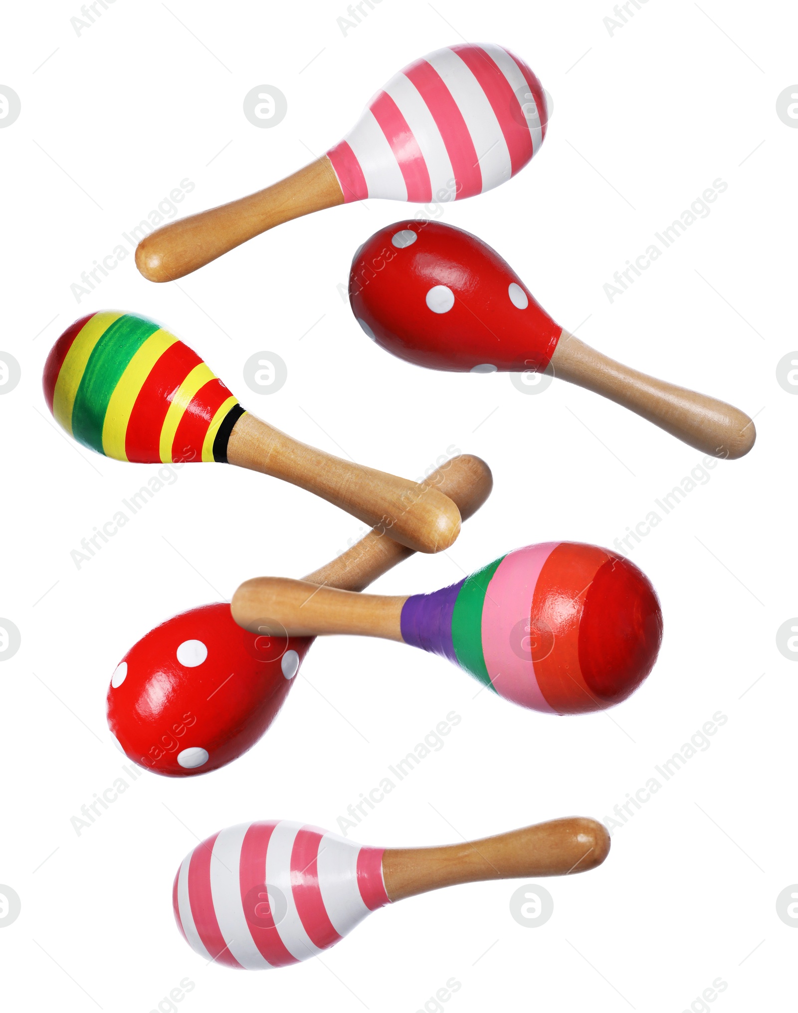 Toy maracas in air on white background. Child's musical instrument Image of Toy maracas in air on white background. Child's musical instrument