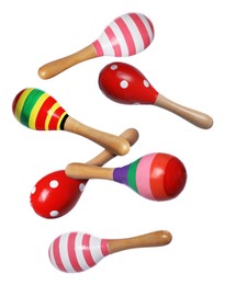 Image of Toy maracas in air on white background. Child's musical instrument