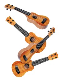 Image of Toy guitars in air on white background. Child's musical instrument