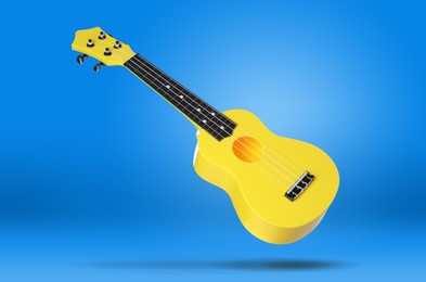 Image of Yellow toy guitar in air on blue background. Child's musical instrument