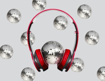 Image of Creative collage with disco balls and headphones on light grey background